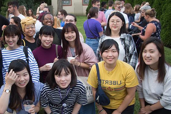 Photo of a group of international students eating ice cream on Chatham University's campus