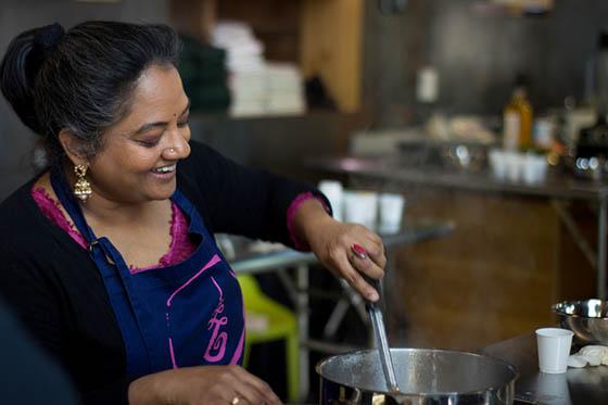 Photo of an Indian woman leading a cooking class for CRAFT
