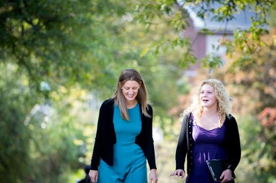 Photo of two Chatham University faculty members walking together on campus